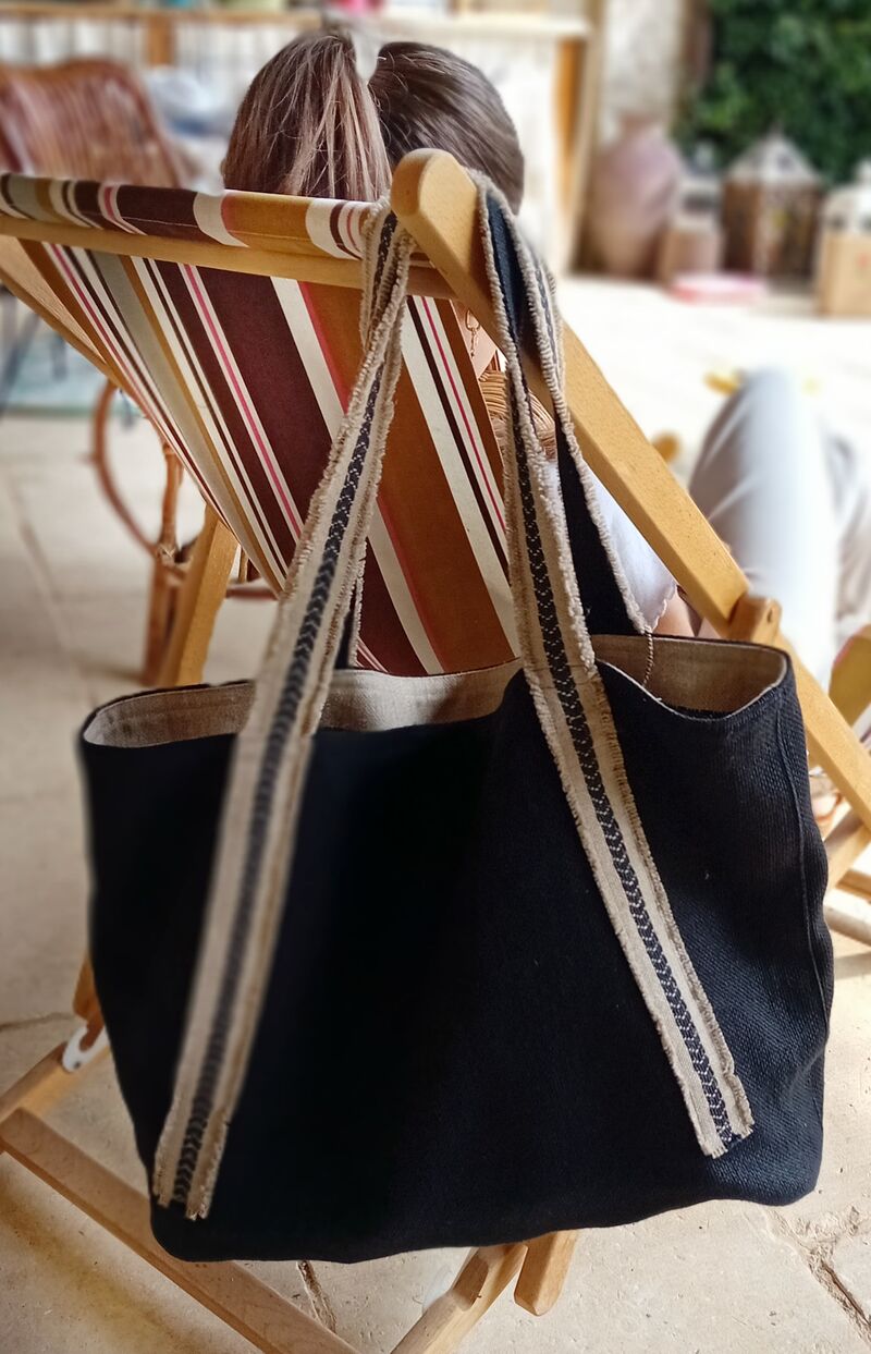 Siena — dark woven shoulder bag with cream stripe straps