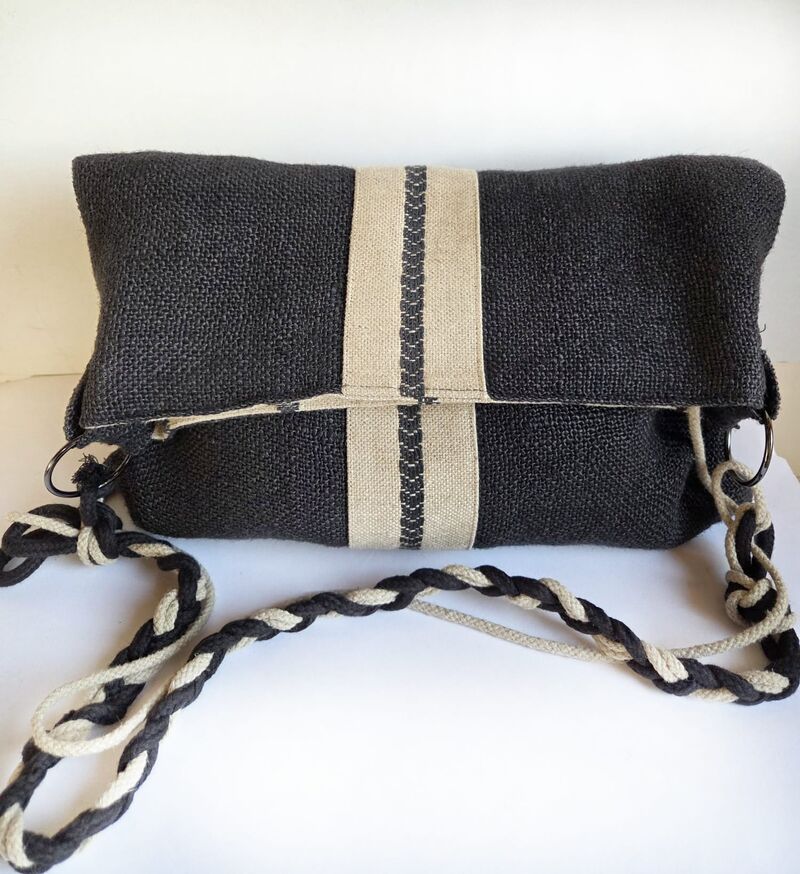 Luna — soft dark textile foldover clutch with cream stripe and braided strap
